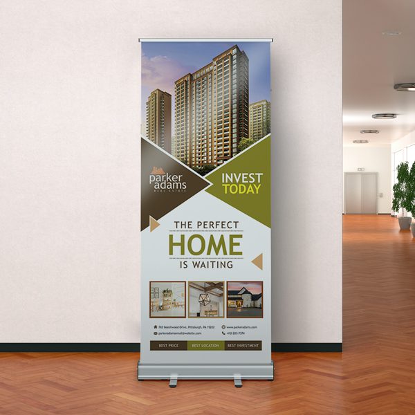 A professional Retractable Banner for real estate marketing, featuring the headline 'THE PERFECT HOME IS WAITING' alongside high-quality photos of modern apartment buildings and interior living spaces.